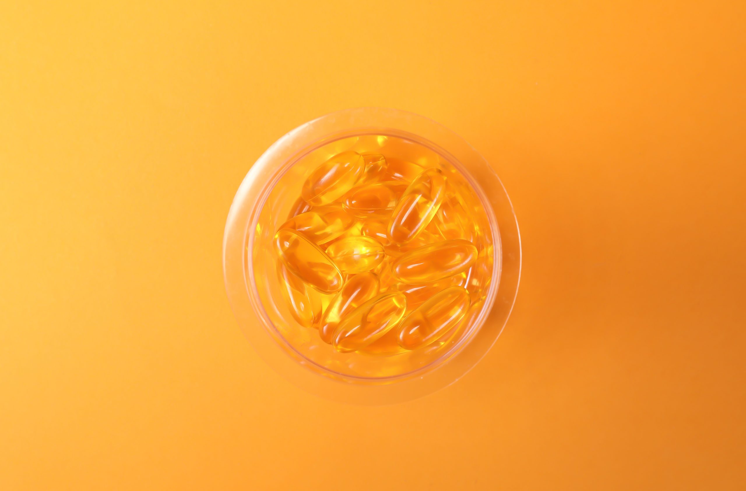 A bottle filled with supplement capsules, a useful visual for ingredient lots, QA checks, and supplement batch records.